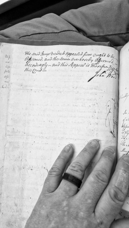 Fragment with partially obscured text from adjacent page